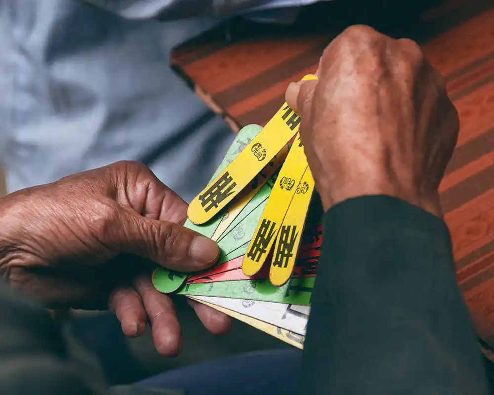 Hands of local playing Hakka cards - from my collection "The Guest Families"