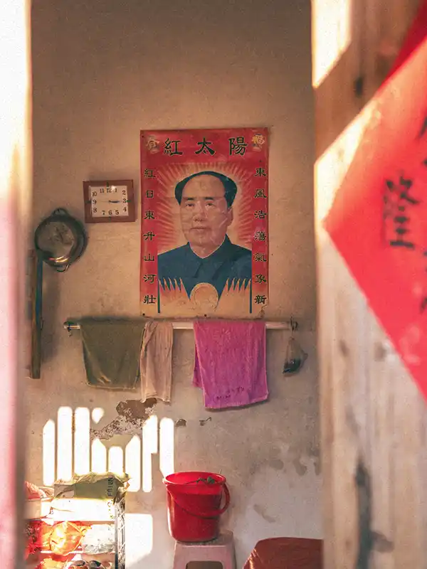 Room of local Tulou with Mao's picture on the wall - , from my collection "The Guest Families"